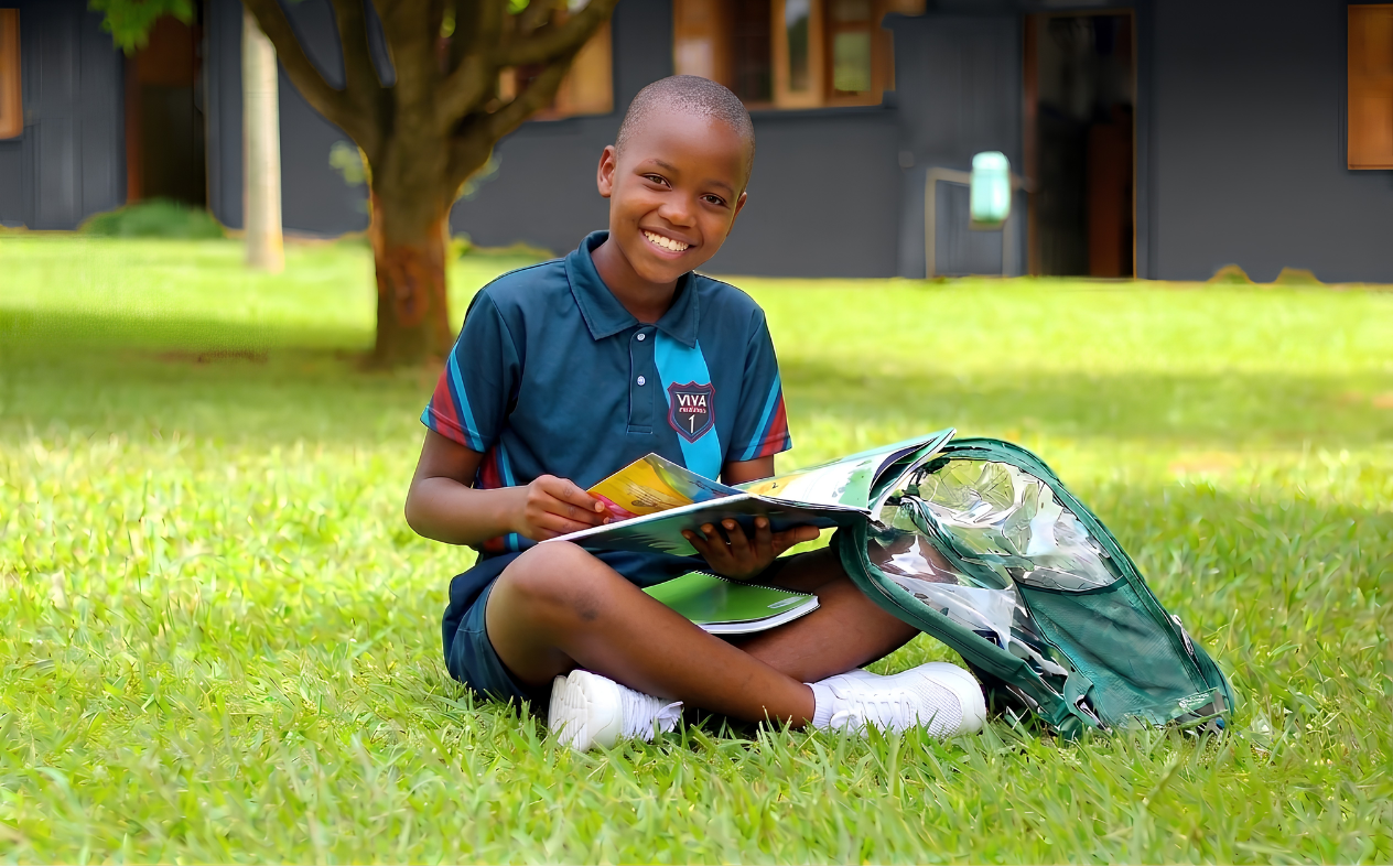 A learner writing in class at Viva Primary