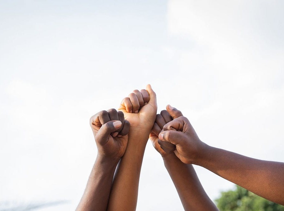 Children joining hands together